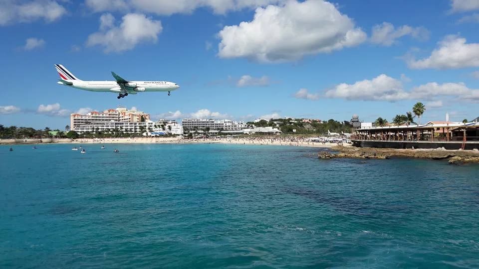Aircraft on final approach over Maho Beach at Princess Juliana International Airport, Sint Maarten